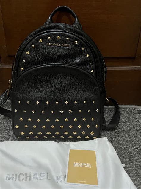 michael kors studded stone riley backpack purse|Abbey Medium Studded Pebbled Leather Backpack .